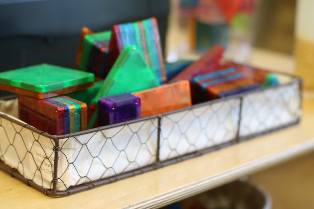 Translucent pattern blocks displayed in a 3-section dip container.