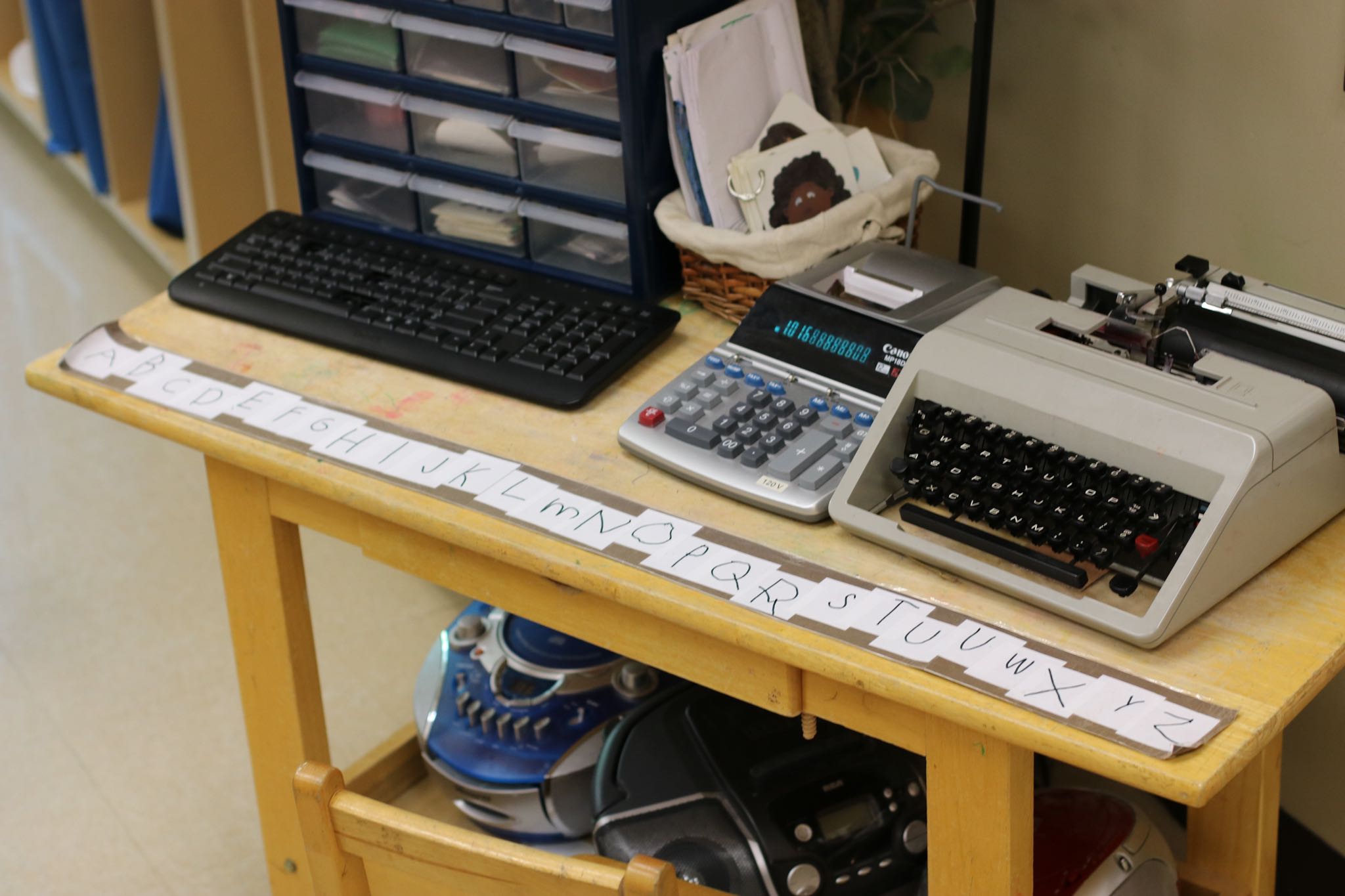 Laminated alphabet strip in writing center.